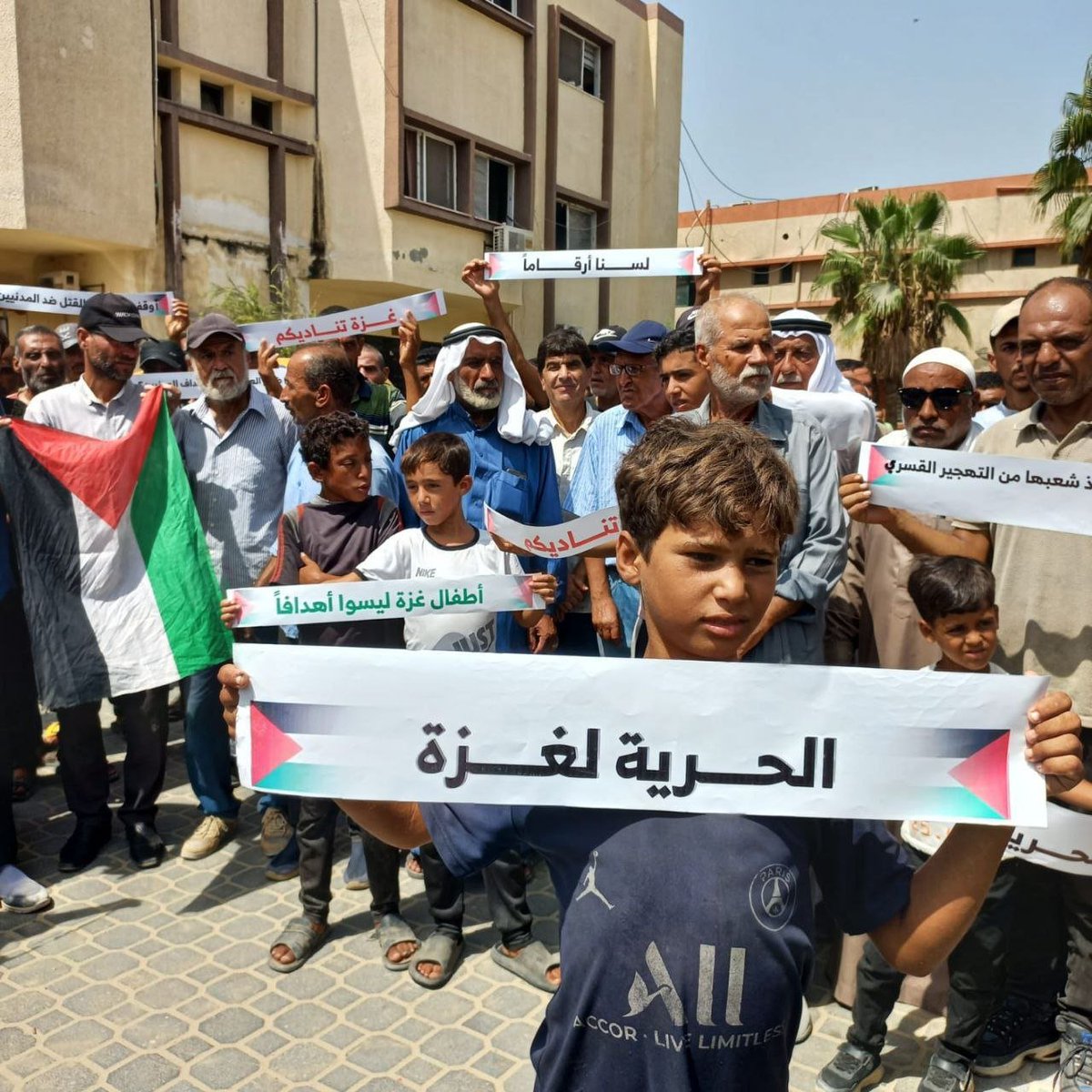 Photos of a protest in front of Nasser Hospital in Khan Yunis, demanding an end to the ongoing war of extermination and starvation in the Gaza Strip.