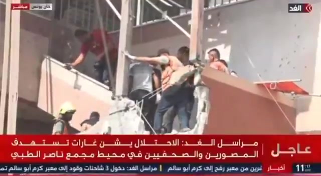 Israel bombs civil defense teams as they try to retrieve the body of journalist Hossam Al-Masri, killed in an Israeli strike on Nasser Hospital