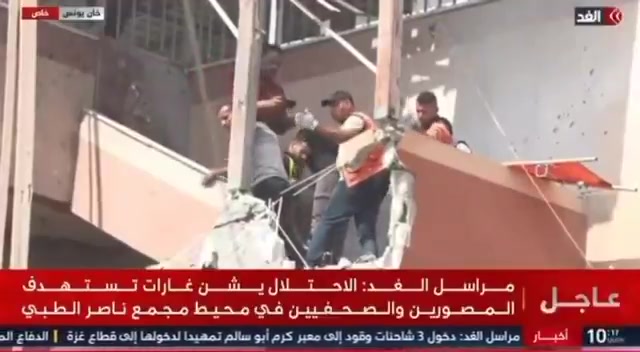 Israel bombs civil defense teams as they try to retrieve the body of journalist Hossam Al-Masri, killed in an Israeli strike on Nasser Hospital