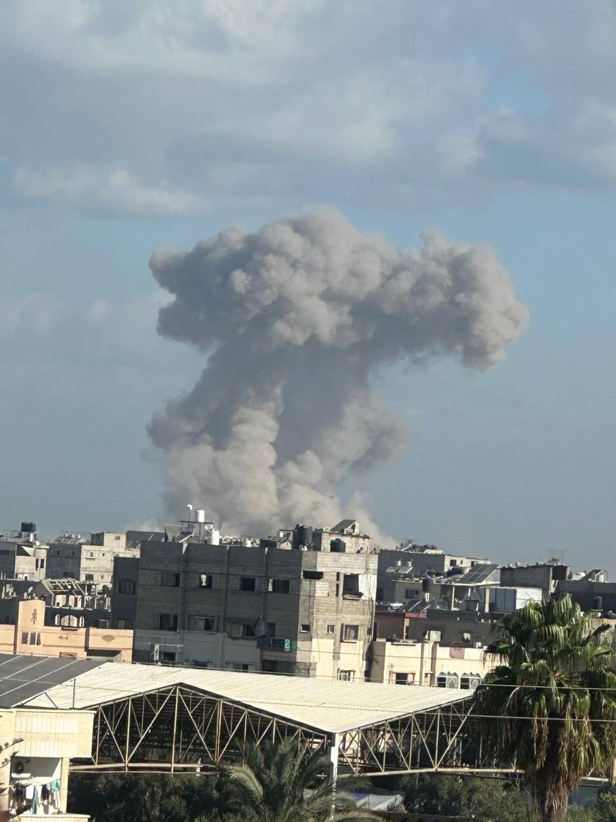 Dangerous and difficult conditions: airstrikes and heavy machine gun fire on Al-Sina'a Street in Gaza City.
