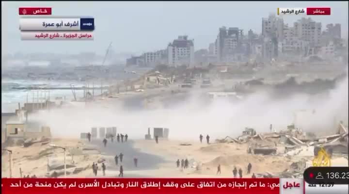 Palestinian media reports that the Israeli army deployed tanks to the Rashid coastal road to prevent Palestinians from returning to Gaza City and the Strip's north. Footage shows the tanks firing shells near a crowd of Palestinians gathering in the area