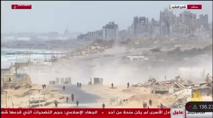 Palestinian media reports that the Israeli army deployed tanks to the Rashid coastal road to prevent Palestinians from returning to Gaza City and the Strip's north. Footage shows the tanks firing shells near a crowd of Palestinians gathering in the area