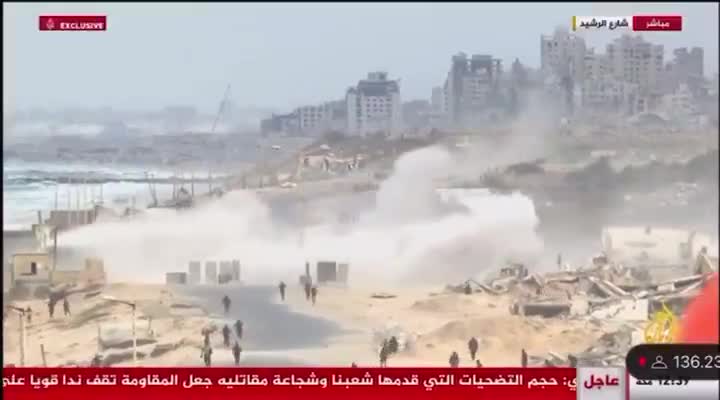 Palestinian media reports that the Israeli army deployed tanks to the Rashid coastal road to prevent Palestinians from returning to Gaza City and the Strip's north. Footage shows the tanks firing shells near a crowd of Palestinians gathering in the area