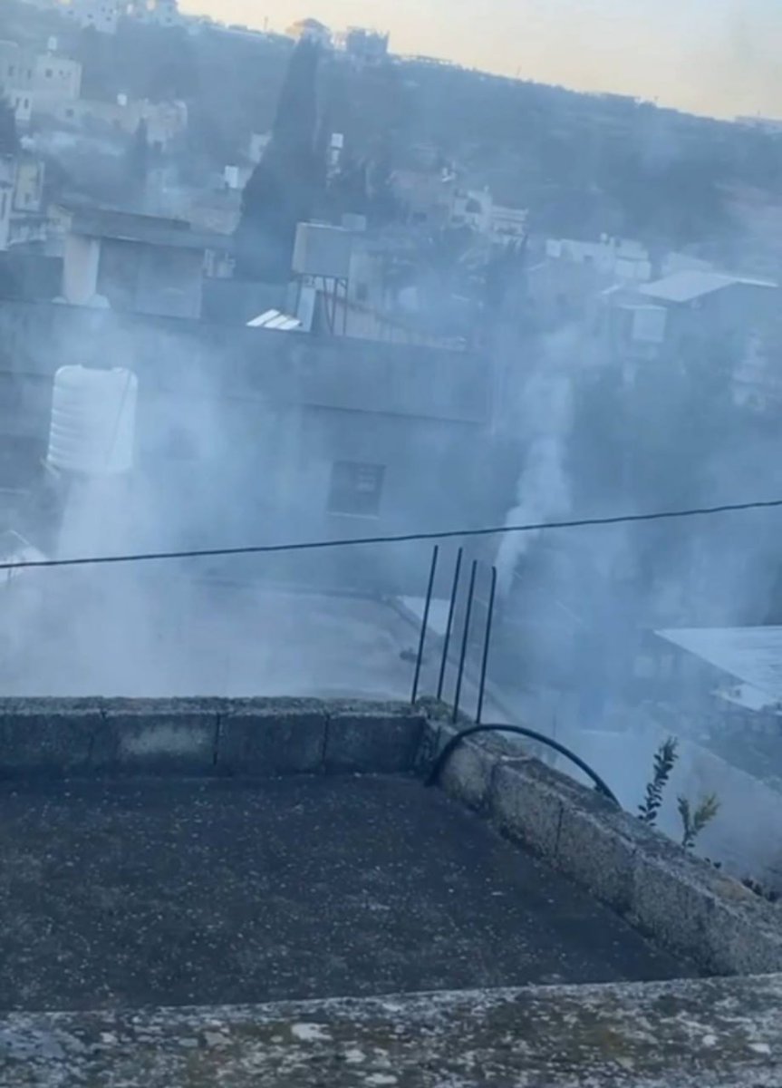 A picture shows tear gas canisters being fired intensively towards citizens' homes in the town of Qusra, south of Nablus.