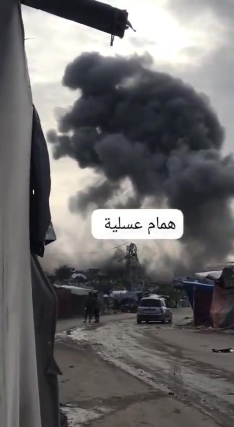 Israel bombs a three-story building at the Asqoula intersection in the Zeitoun neighborhood, southeast of Gaza City