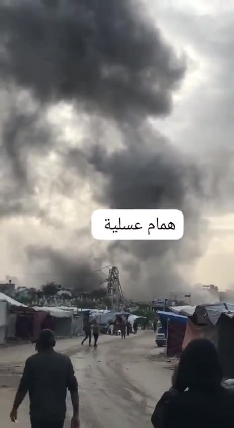 Israel bombs a three-story building at the Asqoula intersection in the Zeitoun neighborhood, southeast of Gaza City