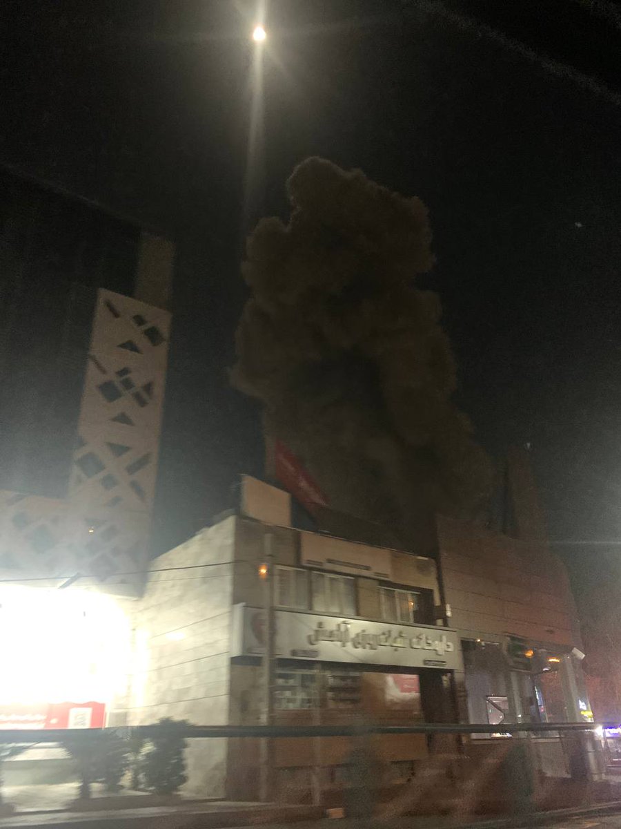 Smoke rose from two explosions near the state broadcaster's headquarters in Tehran.