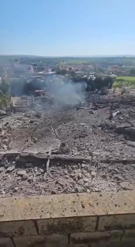 The aftermath of the bombing in the town of Kafr Tebnit in southern Lebanon following an airstrike.