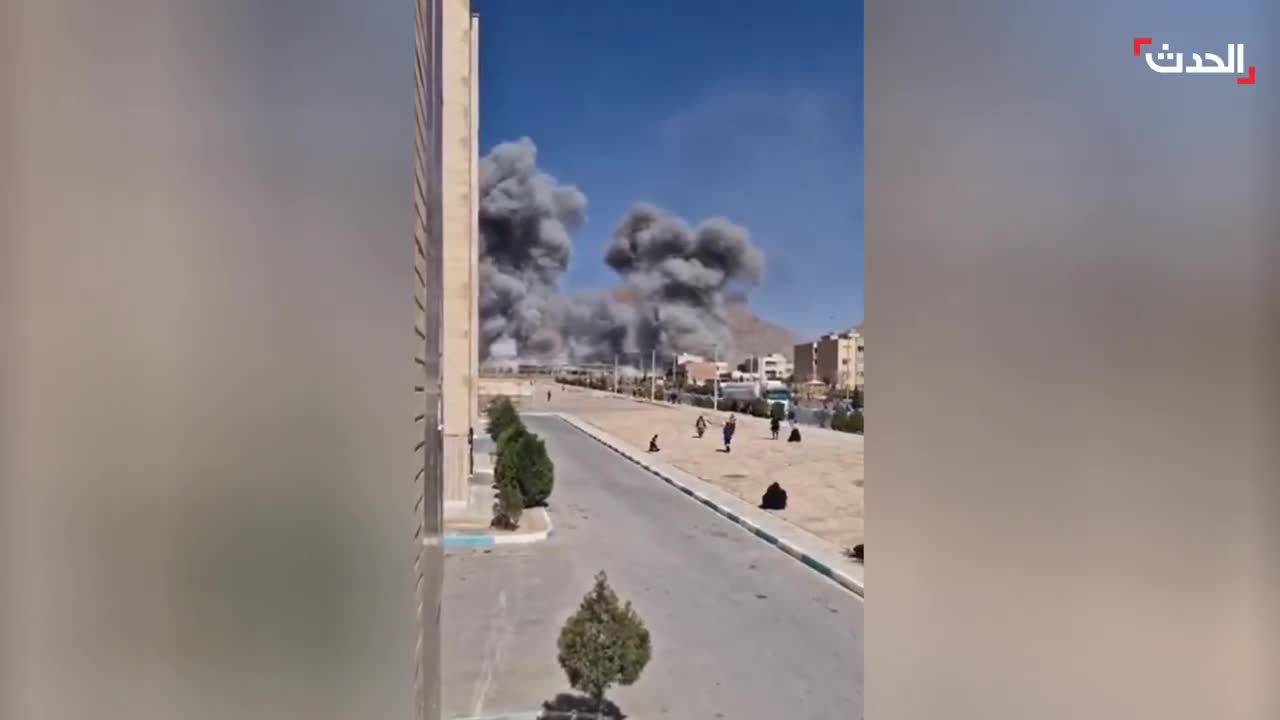 Footage shows the bombing of the Imam Ali barracks in Najafabad, Isfahan province, Iran, by Israeli-American airstrikes. Plumes of smoke rise from the targeted site.