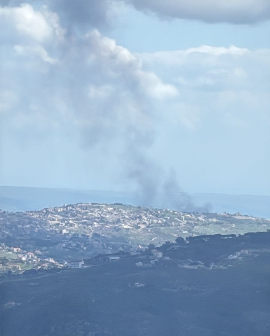 The scene from south of Khiam shows Israeli vehicles being targeted and burning.