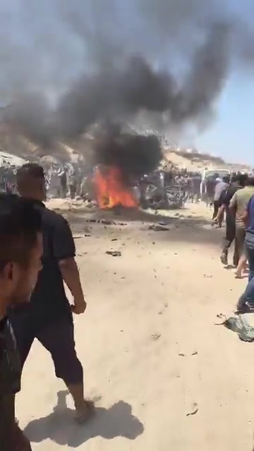 The first moments of the airstrike that targeted a civilian Jeep vehicle on Al-Tina Street, north of Khan Yunis city.