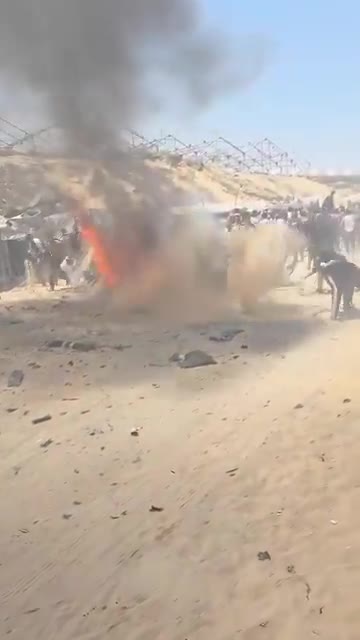 The first moments of the airstrike that targeted a civilian Jeep vehicle on Al-Tina Street, north of Khan Yunis city.