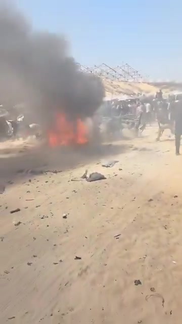 The first moments of the airstrike that targeted a civilian Jeep vehicle on Al-Tina Street, north of Khan Yunis city.