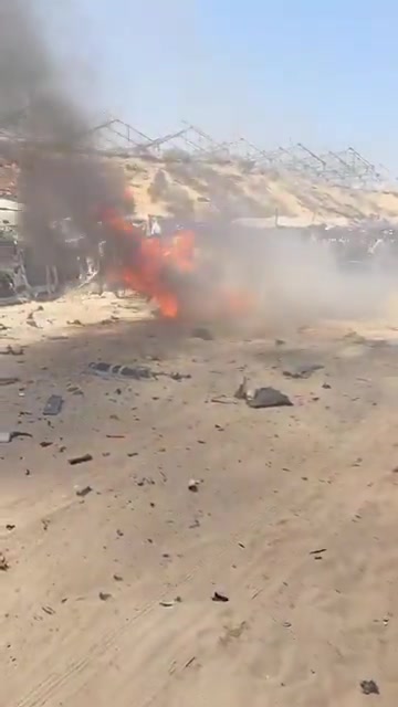 The first moments of the airstrike that targeted a civilian Jeep vehicle on Al-Tina Street, north of Khan Yunis city.
