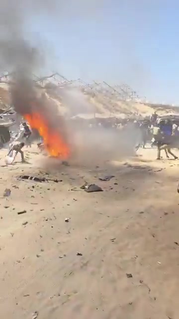 The first moments of the airstrike that targeted a civilian Jeep vehicle on Al-Tina Street, north of Khan Yunis city.